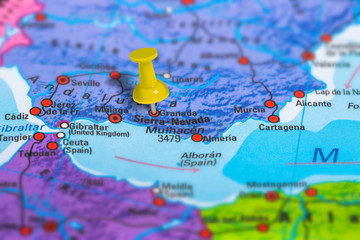 Granada in Spain pinned on colorful political map of Europe. Geopolitical school atlas. Tilt shift...