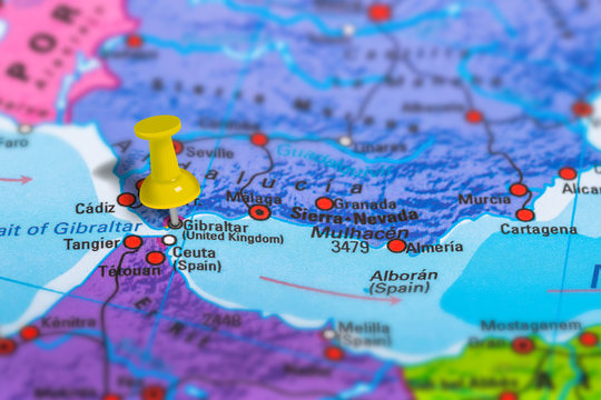 Gibraltar in United Kingdom pinned on colorful political map of Europe. Geopolitical school atlas. Tilt shift effect.