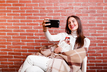 Girl with lap robe sitting on chair