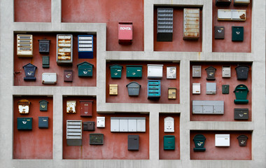 Different mailboxes decoration hanging on the wall