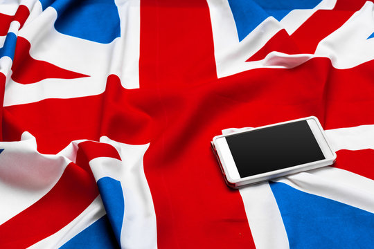 smart phone or cell phone over United kingdom flag