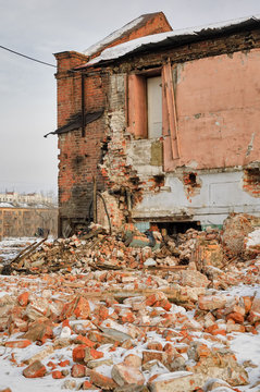 Tyumen, Russia - February 16, 2008: Demolition of machine-tool factory. Destroyed building on foreground