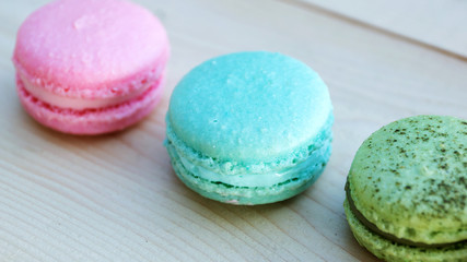 colorful cake macaron or macaroon on wooden background.