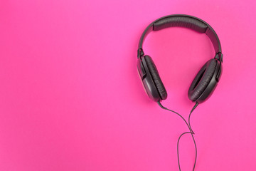 headphones on pink background