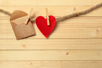 paper heart pinned in line on twine rope