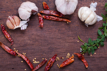 dried red chilli and garlic on a wooden background