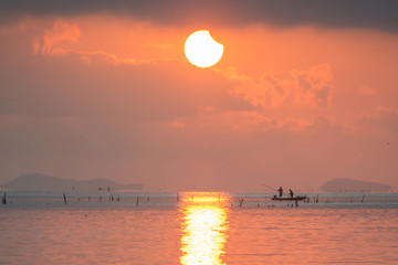 Solar eclipse (partial) at the Lampam  lake shore ,Phatthalung province, Thailand.