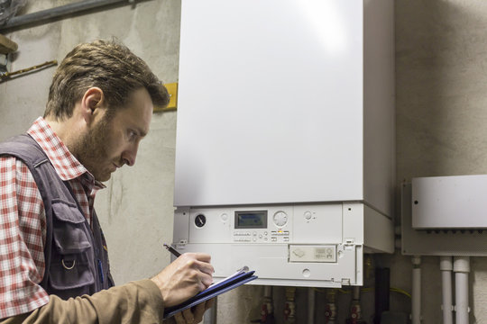 plumber who carries out the maintenance of a condensing boiler