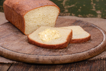 Sliced white bread on wooden board table