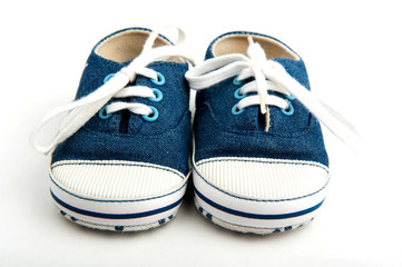 baby sneakers on white background