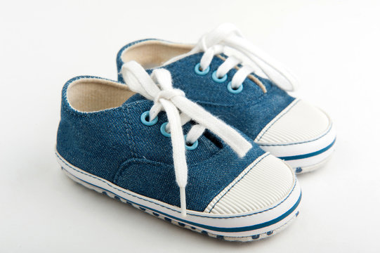 baby sneakers on white background