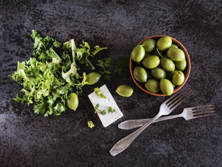 Feta cheese with olives and green herbs