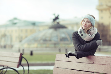 urban portrait of woman in winter clothes