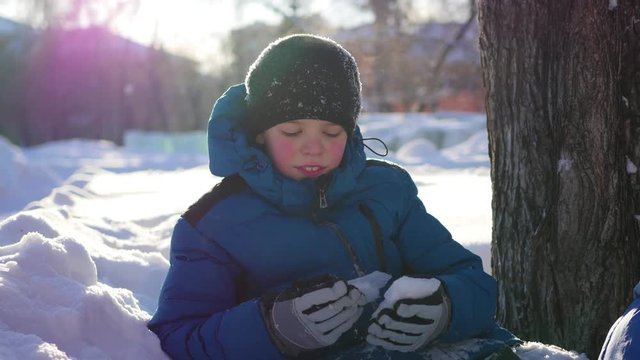 happy child having fun in winter Park on a Sunny day