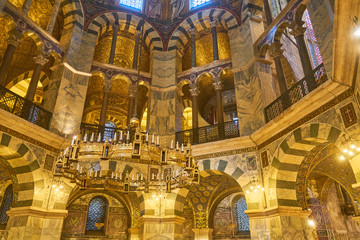 Fototapeta na wymiar Beautiful mosaic inside the octagon-shaped interior of the Aachen Cathedral, which is listed under the world heritage sites fo the UNESCO