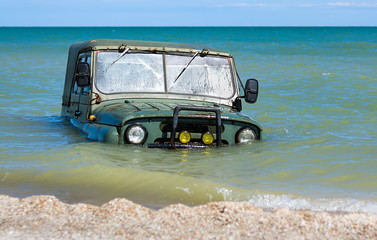 car sinking in the sea
