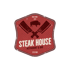 Steak House vintage Label. Typography letterpress design. Vector steak house retro logo. Included bbq grill symbols for customizing steak house badge.Colorful insignia isolated