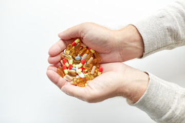 Fototapeta premium close up of old man hands holding medicine