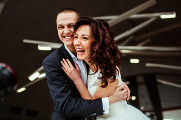 The lovely couple in love embracing in restaurant