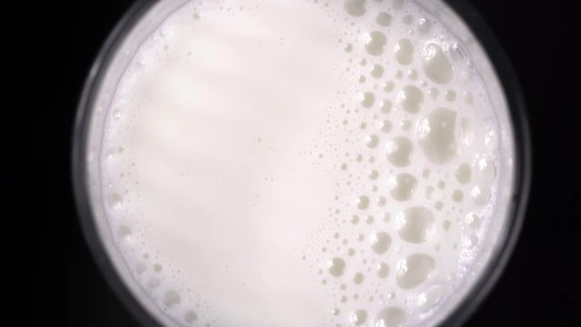 Bubble milk on black background. Closeup
