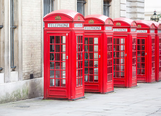 Obraz na płótnie Canvas Five Red London Telephone boxes all in a row