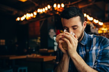 Handsome natural man drinking tea