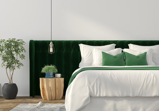 Trendy interior with green bed and wooden table