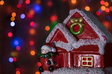 Christmas toy house with a snowman