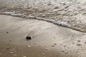 Black stone on the beach
