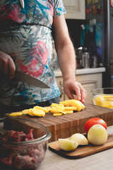Cooking baked meat with potatoes vertical