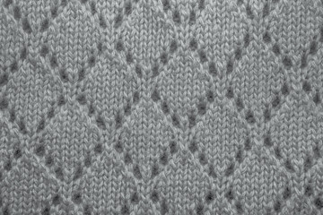 Pink wool sweater texture close up.