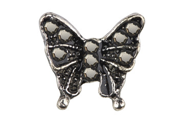 Close-up on silver butterfly-shaped earring with black diamonds, isolated on white background