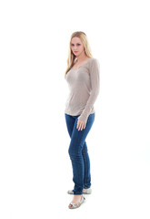 Obraz premium full length portrait of pretty blonde girl wearing casual brown shirt and jeans. standing pose isolated against white background