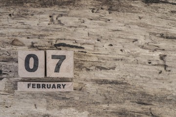 cube calendar for february on wooden background