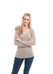 pretty blonde haired girl wearing simple brown shirt and jeans. white background.