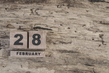cube calendar for february on wooden background