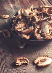 Full bowl od dried apple on the wooden table. Rustic style