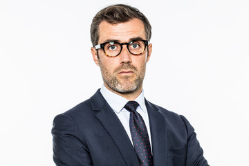 daydreaming bearded middle aged businessman with eyeglasses thinking about leadership