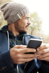 Handsome hipster modern man using smart phone