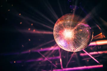 Fotobehang Disco ball with bright rays, night party © evannovostro