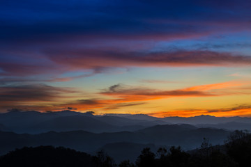 Fototapeta premium Sky scape scenic view from the top of mountain peak with beautiful cloudy sunset twilight sky, Tak, Thailand