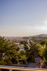 Obraz premium View of shore and city of Bibione, sunset.