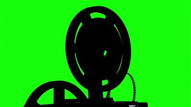 The film turns the projector. Studio green screen silhouette