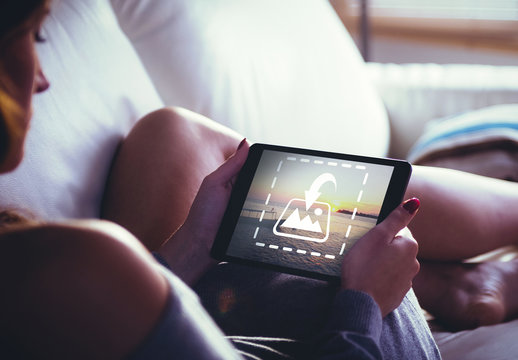 Woman Using Tablet on Couch Mockup