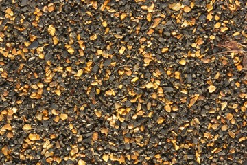 asphalt texture background with black and orange grains