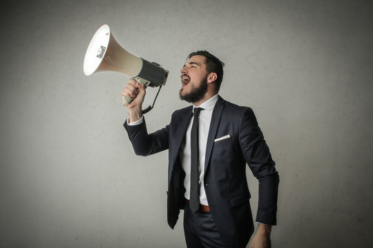 Employee shouting through a megaphone