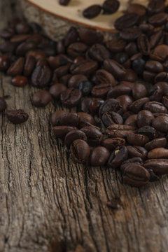 Coffee beans on old wooden table
