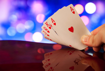 Royal flush poker cards combination on blurred background casino luck fortune