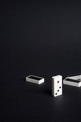 last man standing dominoes concept vision black background