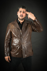 Obraz premium Handsome man doing different expressions in different sets of clothes: suicide